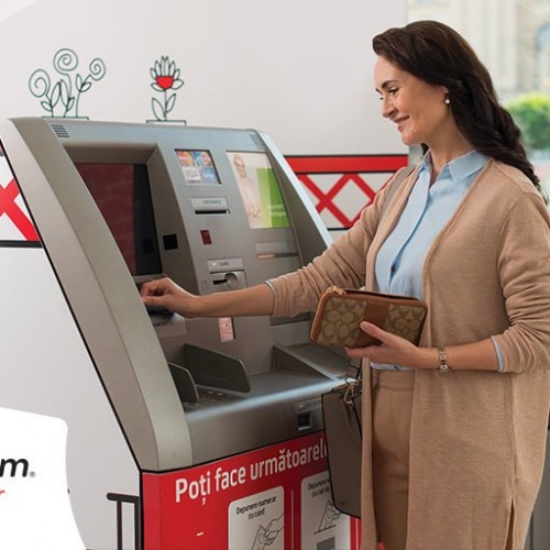 MoneyGram Photo of woman using ATM