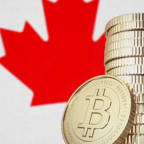 A stack of Bitcoin cryptocurrency in front of the Canadian flag