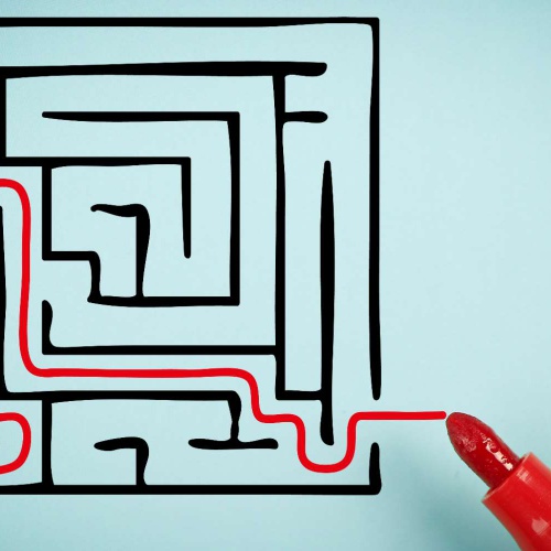 A red line being drawn through a maze.