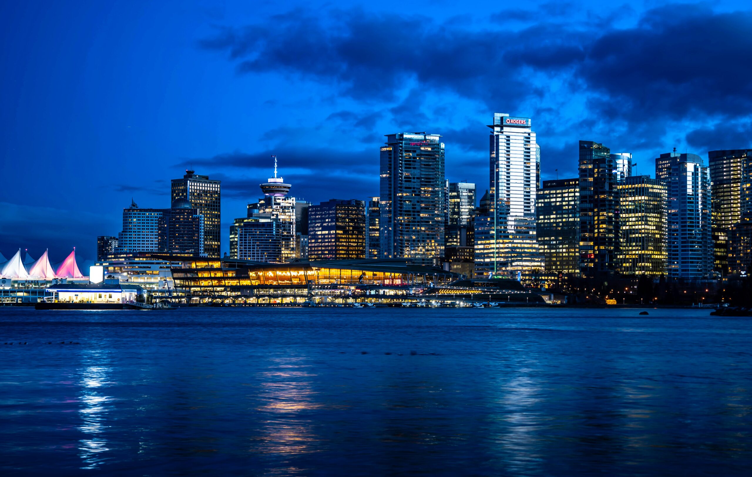 View of the Vancouver skyline reflected across a harbour, representing the Vancouver commercial real estate lawyers at EKB law firm