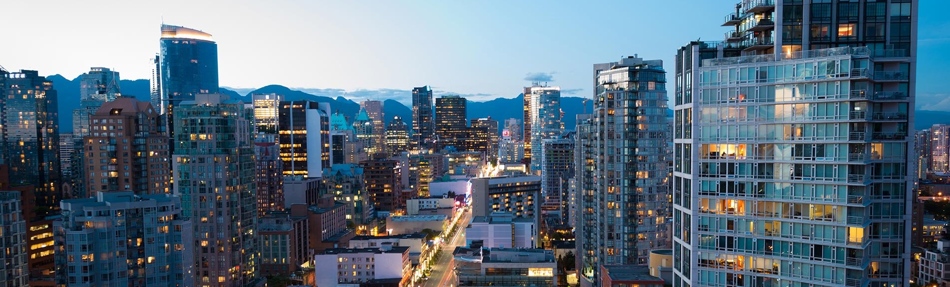 Downtown Vancouver skyline at dusk, representing EKB and 60+ years of commercial legal services in BC